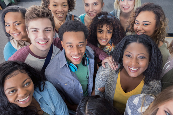 Group of people smiling and looking upwards